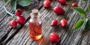 a-small-jar-of-oil-next-to-roseh - Daily Health Tips: Simple Tricks for a Healthier Life Rosehip Oil